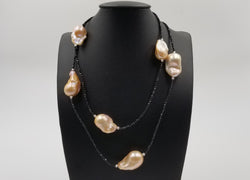 38"PINK FRESHWATER BAROQUE SHAPE PEARL W/ BLACK SPINAL NECKLACE AND STERLING SILVER BEADS AND CLASP