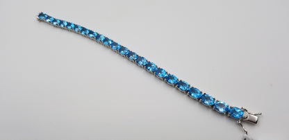 BLUE TOPAZ OVAL SHAPE 6X8 MM STERLING SILVER TENNIS BRACELET