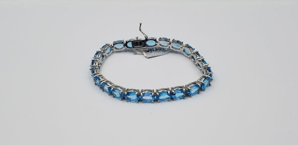 BLUE TOPAZ OVAL SHAPE 6X8 MM STERLING SILVER TENNIS BRACELET