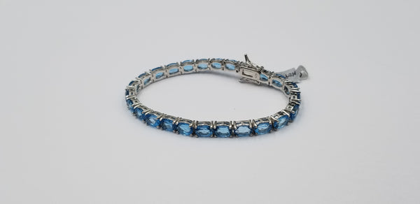 BLUE TOPAZ 5X7 MM OVAL SHAPE STERLING SILVER TENNIS BRACELET