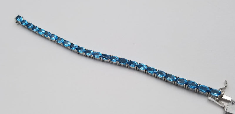 BLUE TOPAZ 5X7 MM OVAL SHAPE STERLING SILVER TENNIS BRACELET