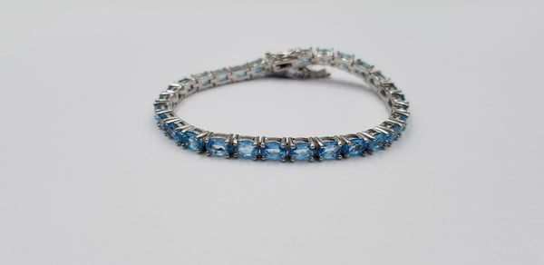 BLUE TOPAZ OVAL 4X6 MM STERLING SILVER TENNIS BRACELET