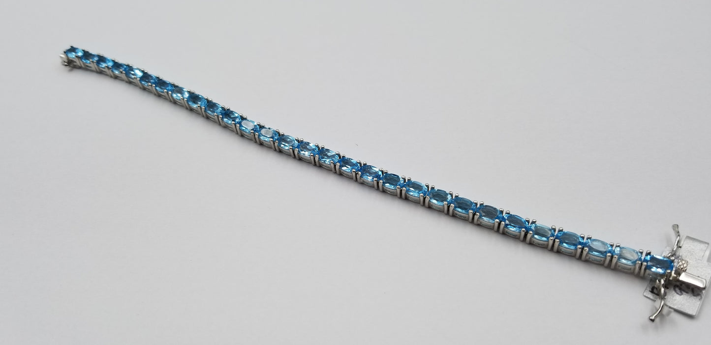 BLUE TOPAZ OVAL 4X6 MM STERLING SILVER TENNIS BRACELET