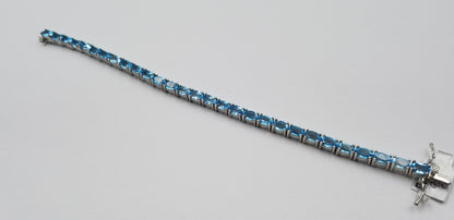 BLUE TOPAZ OVAL 4X6 MM STERLING SILVER TENNIS BRACELET