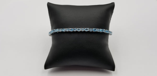 BLUE TOPAZ OVAL 3X5 MM STERLING SILVER TENNIS BRACELET