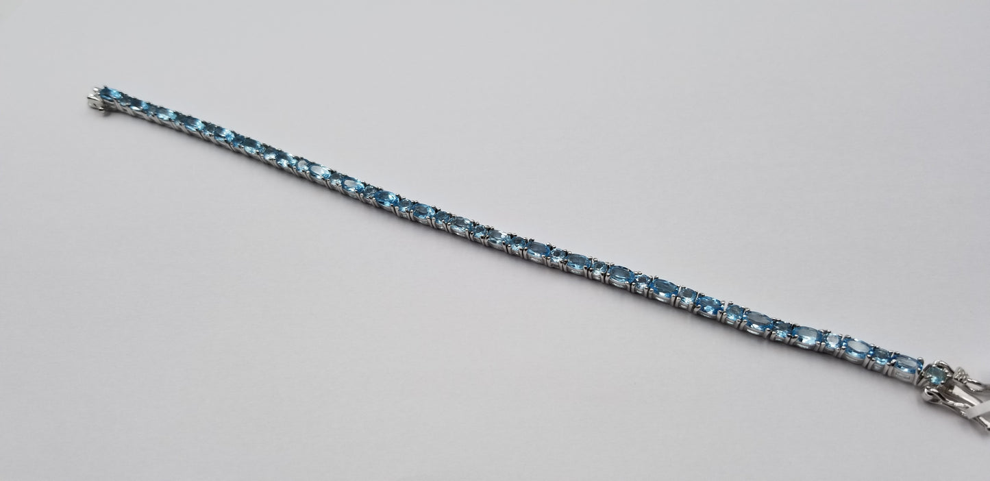 BLUE TOPAZ OVAL 3X5 MM STERLING SILVER TENNIS BRACELET