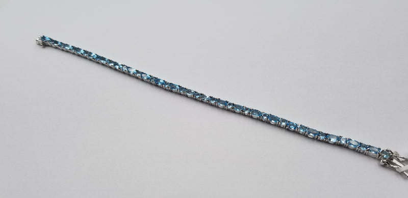 BLUE TOPAZ OVAL 3X5 MM STERLING SILVER TENNIS BRACELET