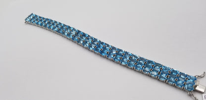 BLUE TOPAZ OVAL SHAPE TRIPLE ROWS STERLING SILVER TENNIS BRACELET