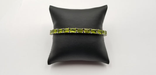 PERIDOTS 5X7 MM EMERALD CUT STERLING SILVER TENNIS BRACELET