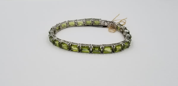 PERIDOTS 5X7 MM EMERALD CUT STERLING SILVER TENNIS BRACELET