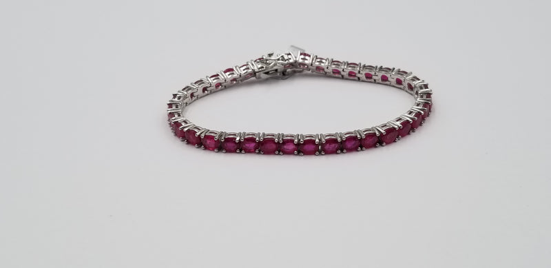 RUBY 4X5 MM OVAL STERLING SILVER TENNIS BRACELET