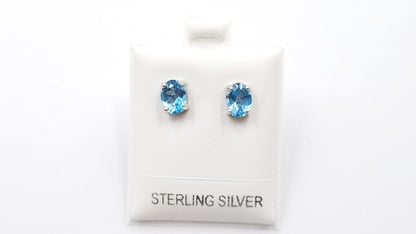 BLUE TOPAZ 6X8MM OVAL PRONG SET STERLING SILVER STUDS EARRINGS