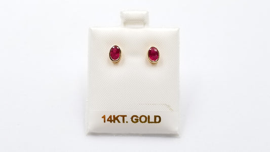 RUBY 5X7 MM OVAL BEZEL SET 14 KT YELLOW GOLD STUDS EARRING