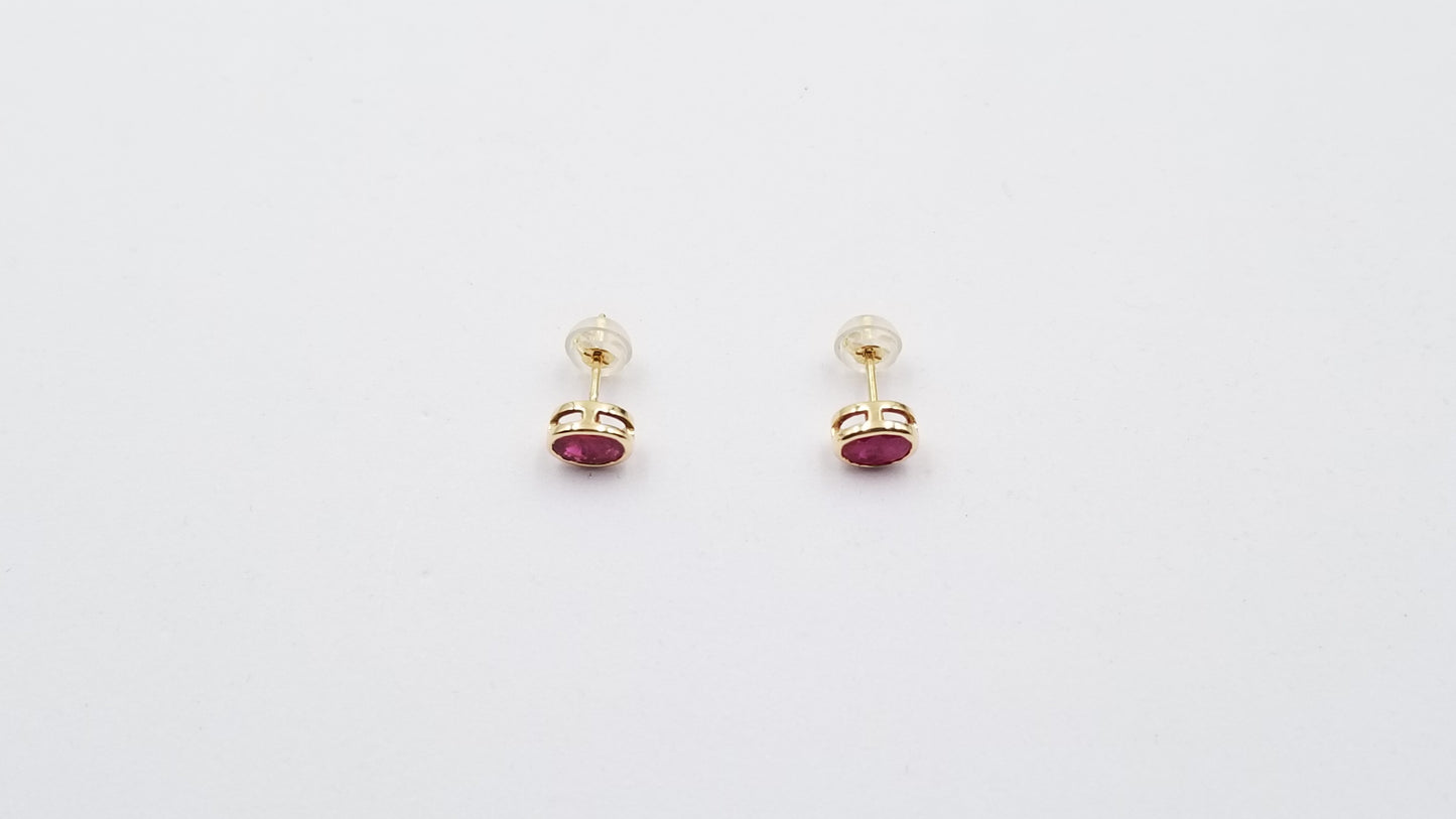 RUBY 5X7 MM OVAL BEZEL SET 14 KT YELLOW GOLD STUDS EARRING