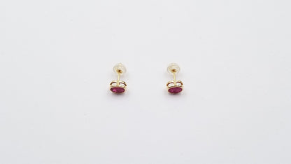 RUBY 5X7 MM OVAL BEZEL SET 14 KT YELLOW GOLD STUDS EARRING