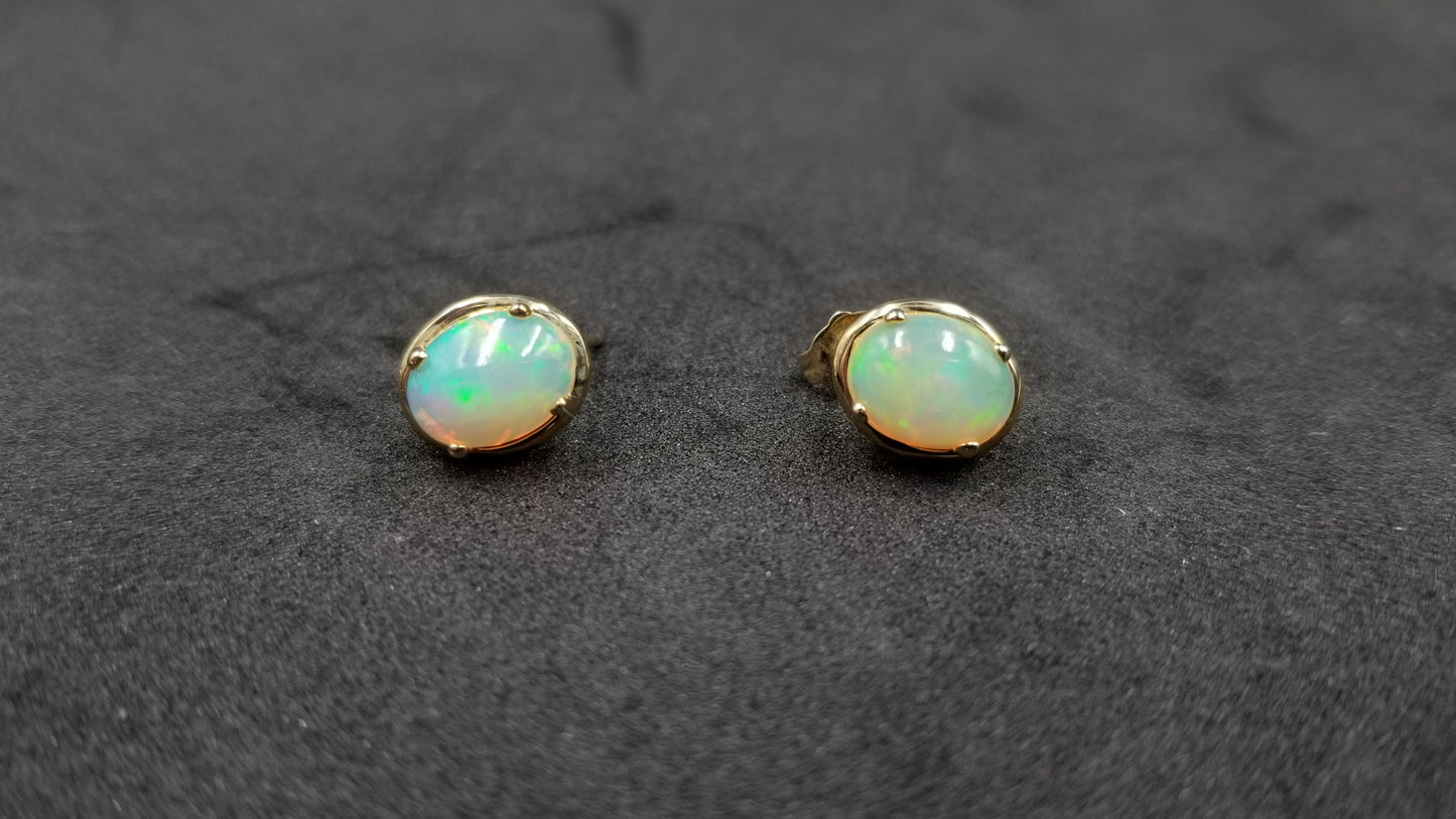 OPAL ( ETHIOPIAN ) 7X9 CABOCHON 14 KT YELLOW GOLD STUDS EARRING