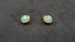 OPAL ( ETHIOPIAN ) 7X9 CABOCHON 14 KT YELLOW GOLD STUDS EARRING