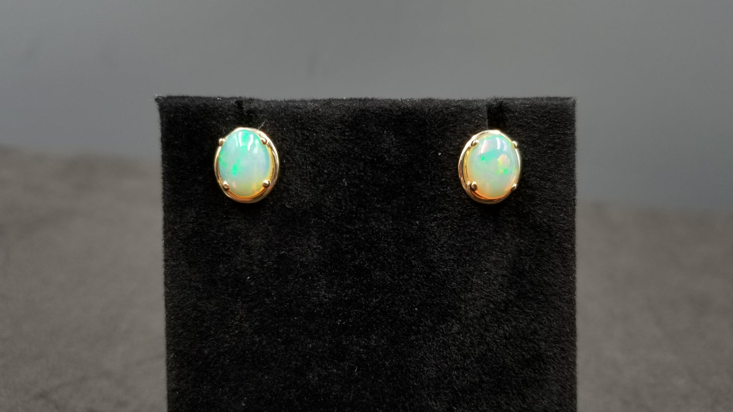 OPAL ( ETHIOPIAN ) 7X9 CABOCHON 14 KT YELLOW GOLD STUDS EARRING