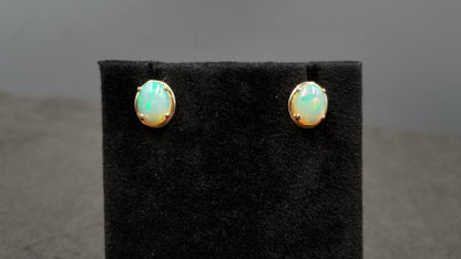 OPAL ( ETHIOPIAN ) 7X9 CABOCHON 14 KT YELLOW GOLD STUDS EARRING