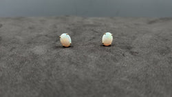 OPAL ( AUSTRALIAN ) 7X9 MM OVAL CABOCHON 14 KT YELLOW GOLD STUDS EARRINGS