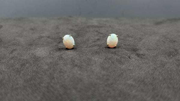 OPAL ( AUSTRALIAN ) 7X9 MM OVAL CABOCHON 14 KT YELLOW GOLD STUDS EARRINGS