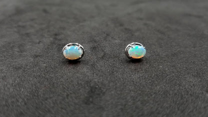OPAL ( AUSTRALIAN )5X7 MM OVAL 14 KT WHITE GOLD STUDS EARRINGS