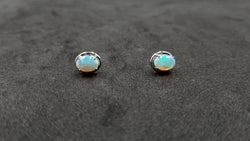 OPAL ( AUSTRALIAN )5X7 MM OVAL 14 KT WHITE GOLD STUDS EARRINGS