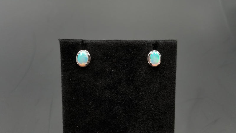 OPAL ( AUSTRALIAN )5X7 MM OVAL 14 KT WHITE GOLD STUDS EARRINGS