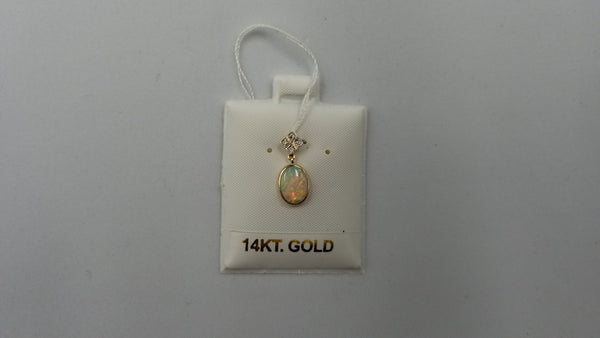 OPAL ( AUSTRALIAN ) 6X8 MM OVAL WITH DIAMNONDS 14 KT YELLOW GOLD PENDANT