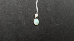 OPAL ( AUSTRALIAN ) 6X8 MM OVAL WITH DIAMNONDS 14 KT YELLOW GOLD PENDANT