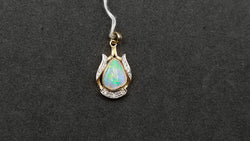 OPAL ( AUSTRALIAN ) FREEFORM WITH DIAMONDS 14 KT YELLOW GOLD BEZEL SET PENDANT