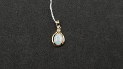 OPAL ( AUSTRALIAN ) OVAL WITH DIAMOND 14 KT YELLOW GOLD PENDANT