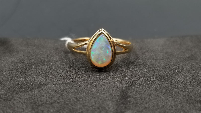 OPAL ( AUSTRALIAN ) PEAR SHAPE BEZEL SET 14 KT YELLOW GOLD RING