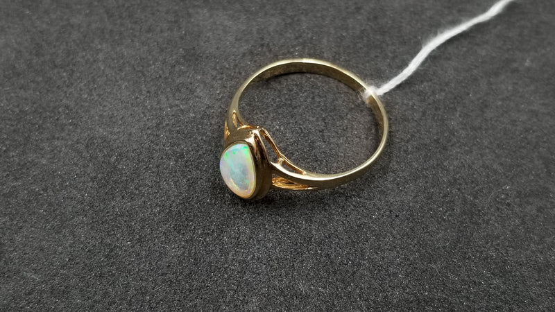 OPAL ( AUSTRALIAN ) PEAR SHAPE BEZEL SET 14 KT YELLOW GOLD RING