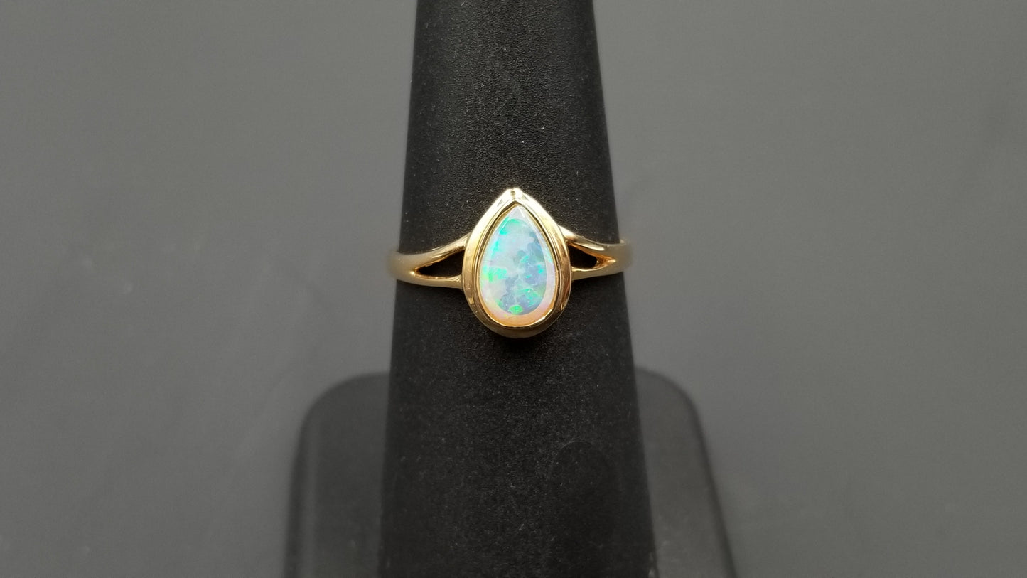 OPAL ( AUSTRALIAN ) PEAR SHAPE BEZEL SET 14 KT YELLOW GOLD RING