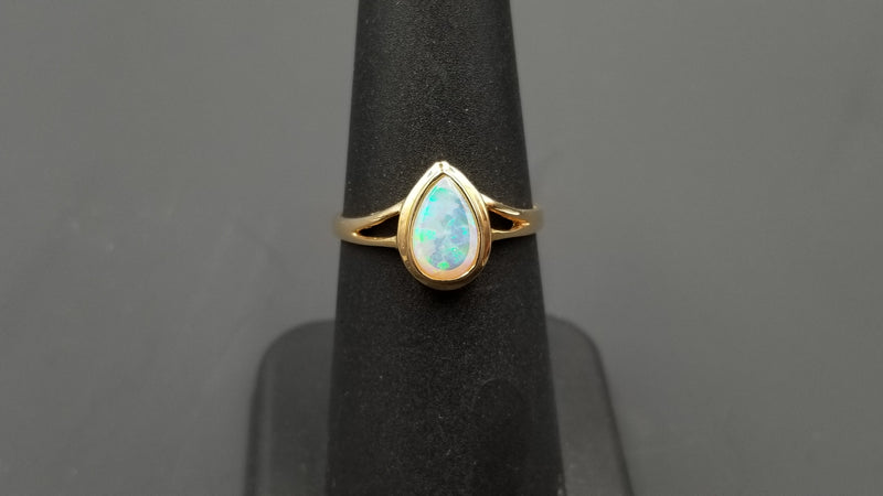 OPAL ( AUSTRALIAN ) PEAR SHAPE BEZEL SET 14 KT YELLOW GOLD RING