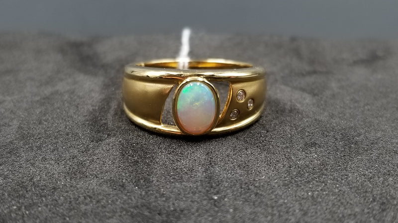 OPAL ( AUSTRALIAN ) OVAL WITH DIAMONDS BEZEL SET 14 KT YELLOW GOLD RING