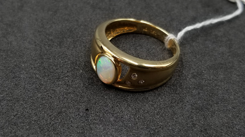 OPAL ( AUSTRALIAN ) OVAL WITH DIAMONDS BEZEL SET 14 KT YELLOW GOLD RING