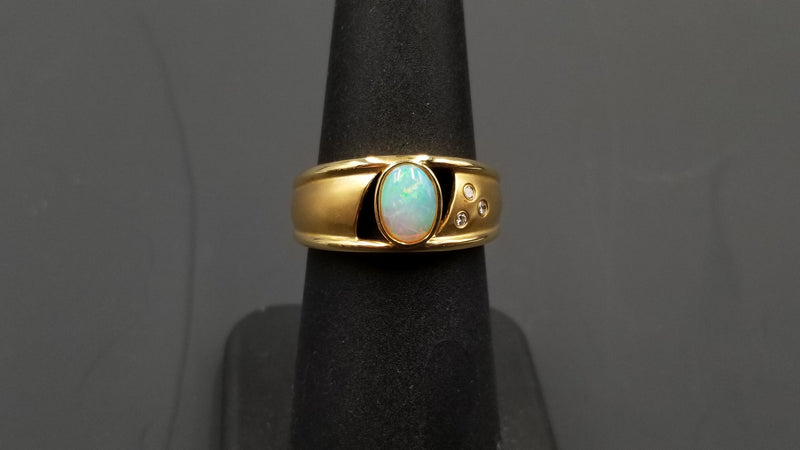 OPAL ( AUSTRALIAN ) OVAL WITH DIAMONDS BEZEL SET 14 KT YELLOW GOLD RING