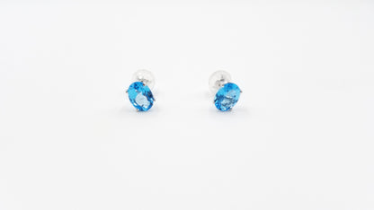 BLUE TOPAZ 6X8 MM OVAL SHAPE 14 KT WHITE GOLD PRONG SET STUDS EARRINGS