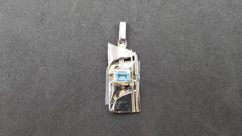 BLUE TOPAZ TWO TONE ( BLACK RHODIUM AND GOLD PLATED ) STERLING SILVER PENDANT