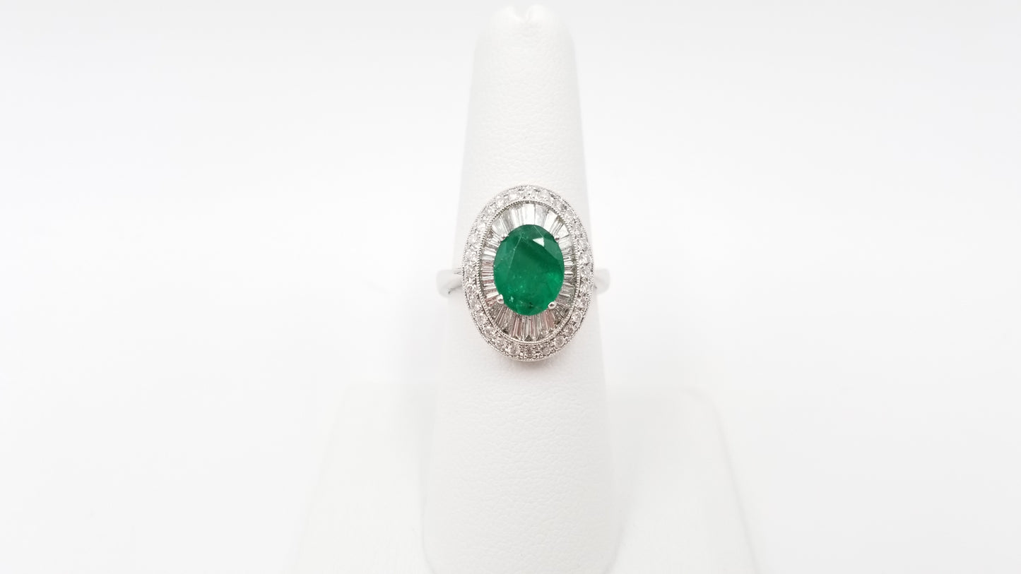 EMERALD ( OVAL ) WITH DIAMONDS IN 18 KT WHITE GOLD RING