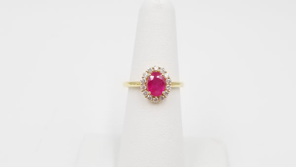 RUBY ( OVAL ) WITH DIAMONDS 18 KT YELLOW GOLD HALO RING