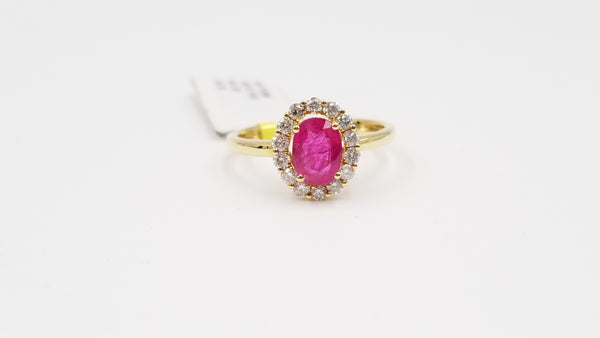 RUBY ( OVAL ) WITH DIAMONDS 18 KT YELLOW GOLD HALO RING
