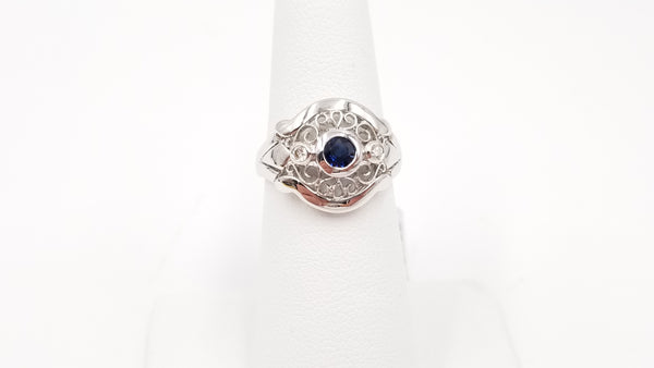 SAPPHIRE WITH DIAMONDS 18 KT WHITE GOLD RING