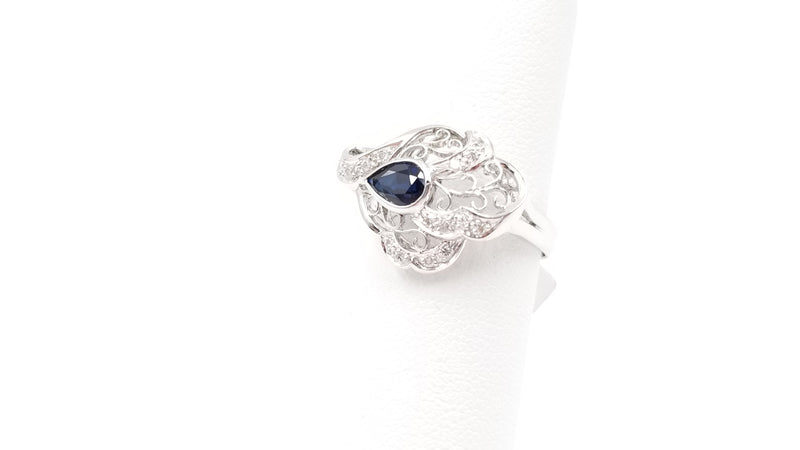 SAPPHIRE ( PEAR SHAPE ) BEZEL SET WITH DIAMONDS 18 KT WHITE GOLD RING