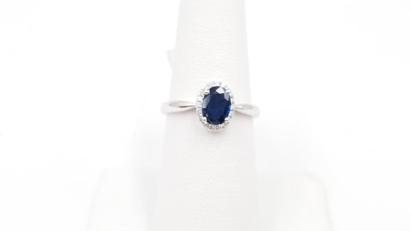 SAPPHIRES ( OVAL ) AND DIAMONDS 18 KT WHITE GOLD HALO RING