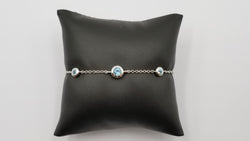 BLUE TOPAZ BEZEL SET 14 KT WHITE GOLD BRACELET