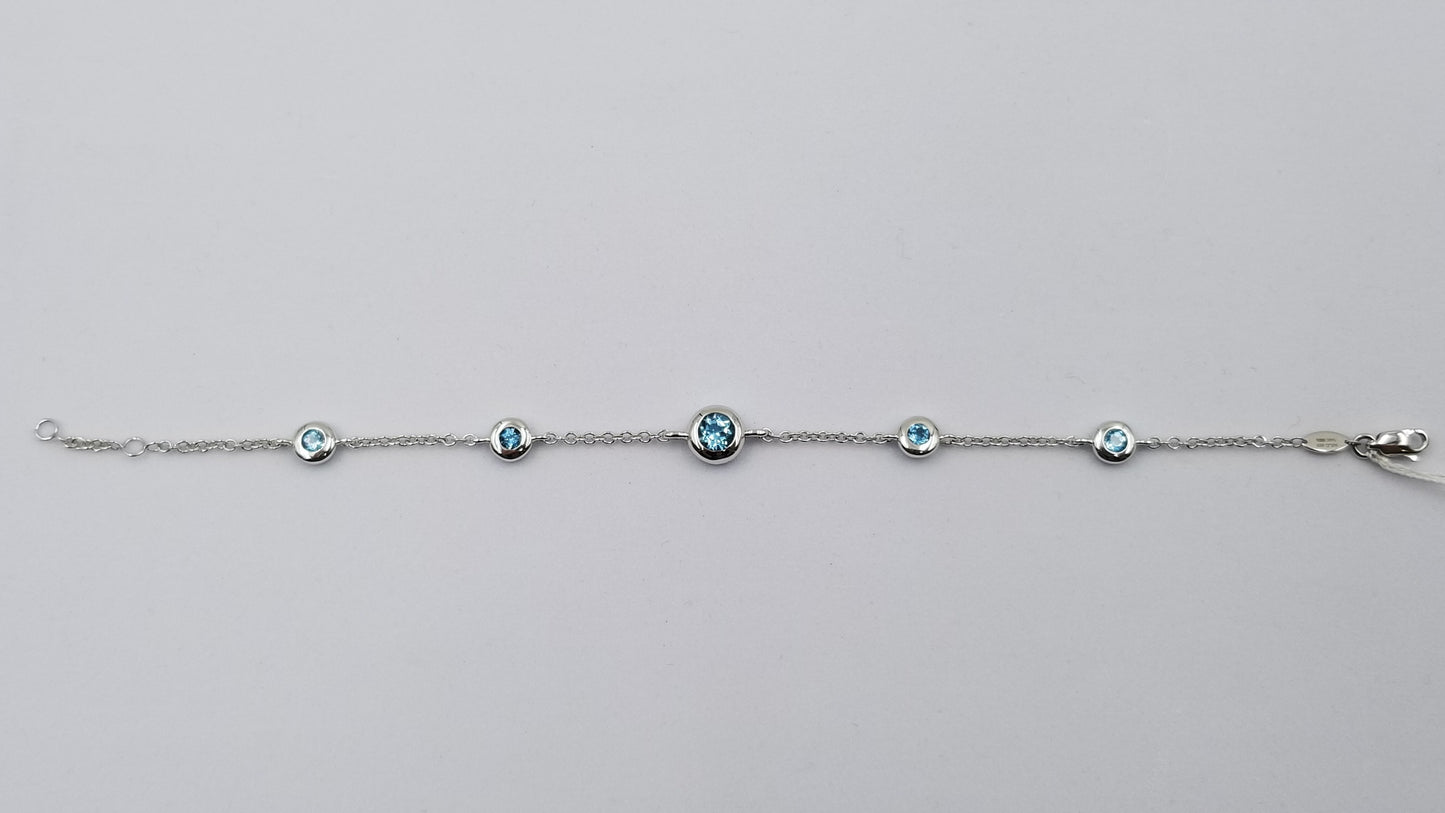BLUE TOPAZ BEZEL SET 14 KT WHITE GOLD BRACELET