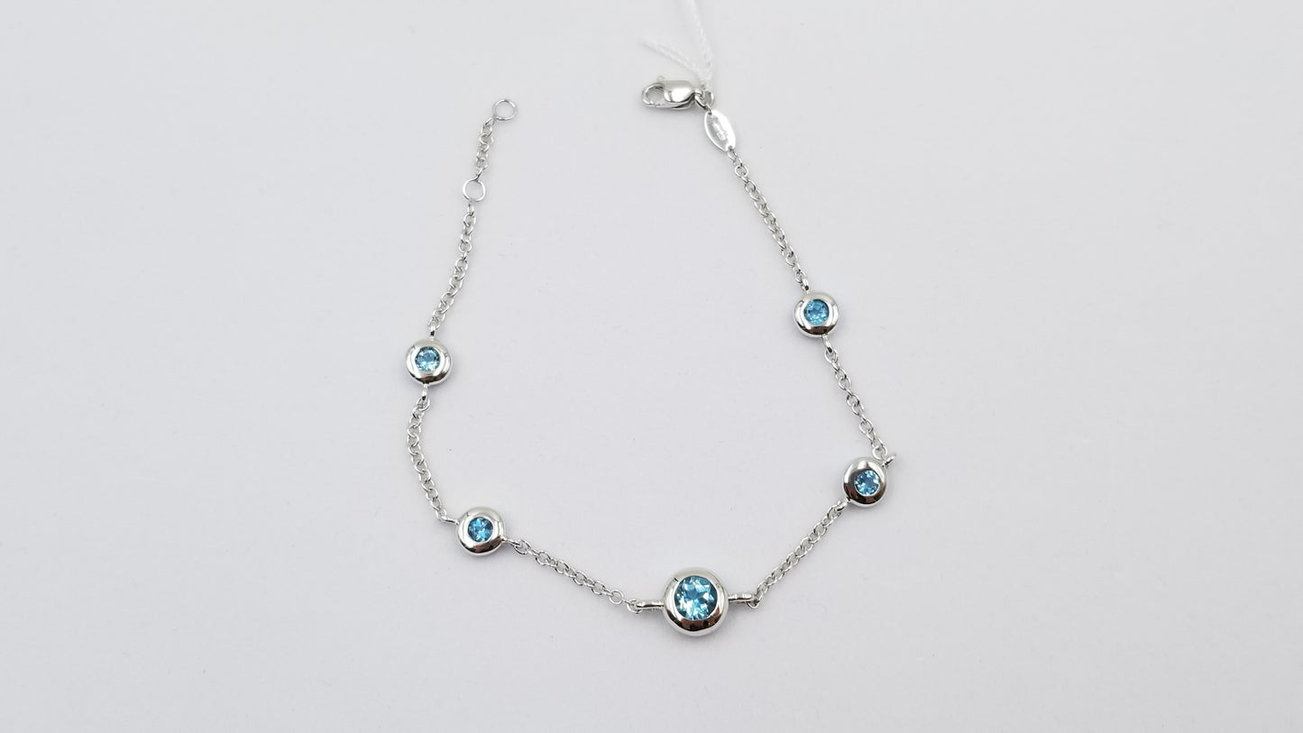 BLUE TOPAZ BEZEL SET 14 KT WHITE GOLD BRACELET